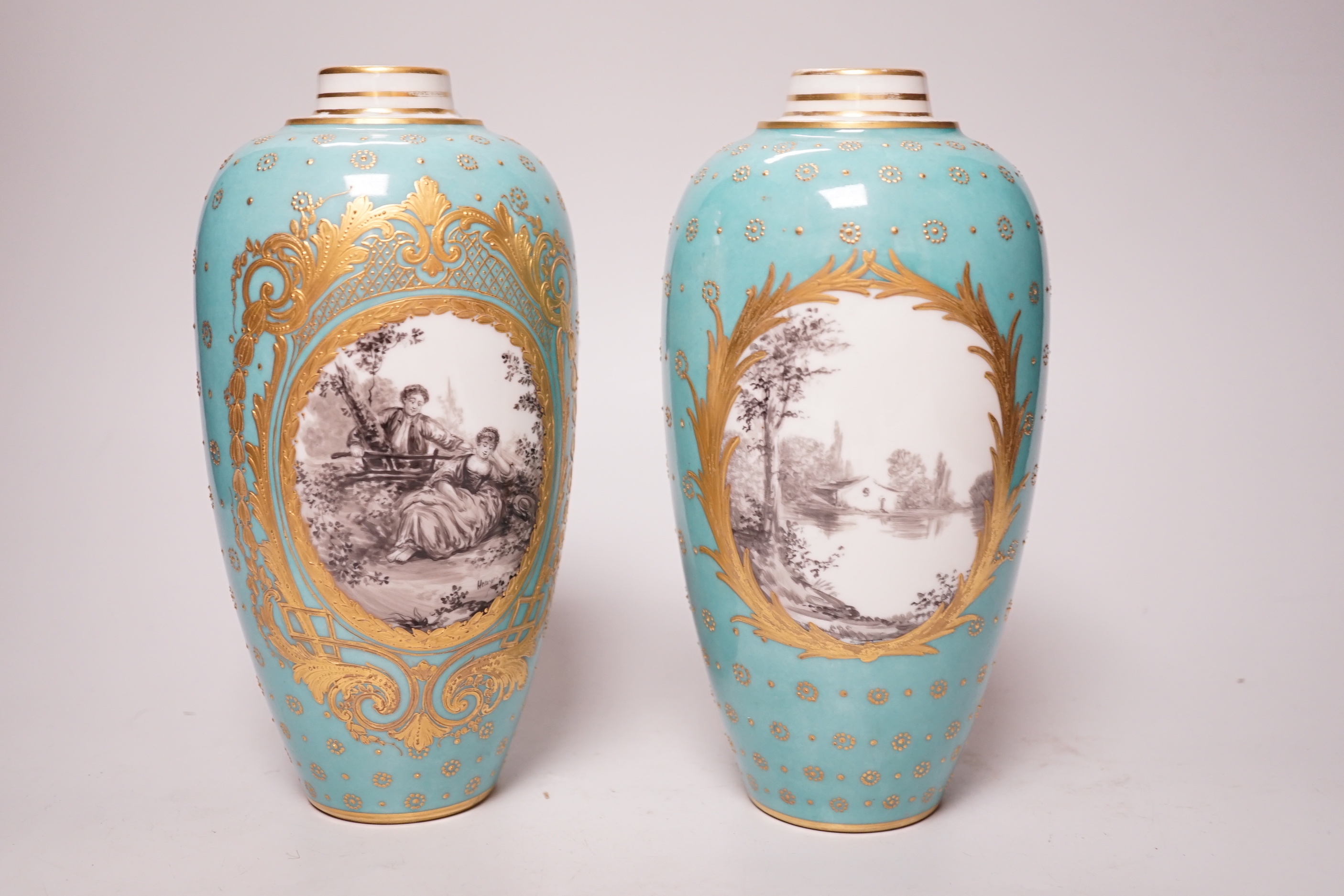 A pair of late 19th century Sevres style turquoise ground vases and covers, 24cm